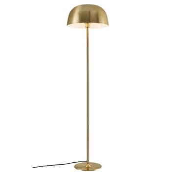 Gold brass floor lamp with a dome shade and a visible power cord against a white background